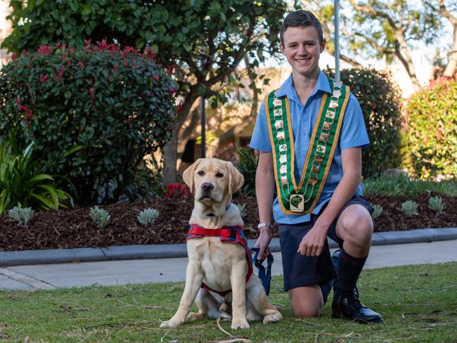 Lockyer Valley young citizen of the year and Toowoomba State High School student Cameron Maizey with prison pup in training Tommy. PHOTO: Ali Kuchel