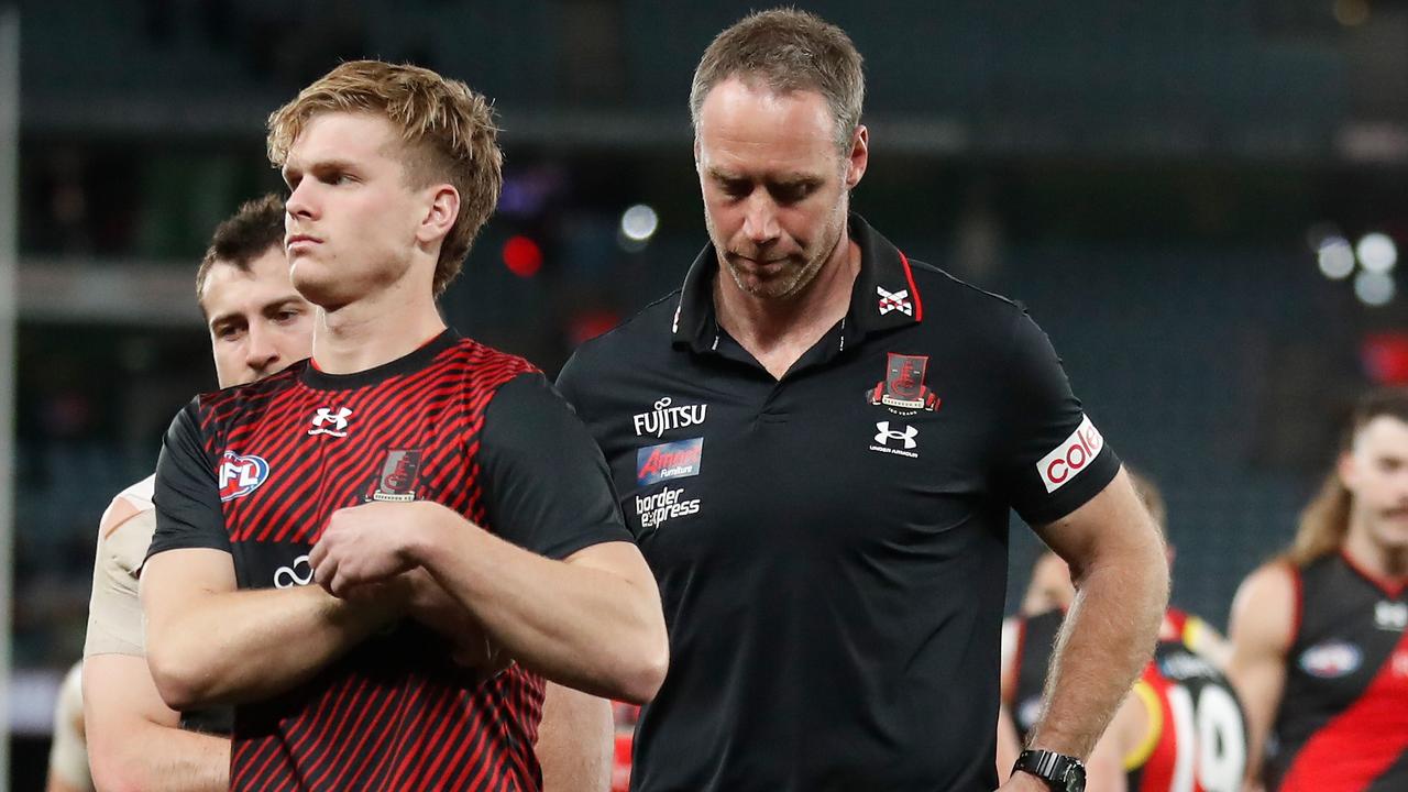MELBOURNE, AUSTRALIA - AUGUST 14: Ben Rutten, Senior Coach of the Bombers looks dejected after a loss during the 2022 AFL Round 22 match between the Essendon Bombers and the Port Adelaide Power at Marvel Stadium on August 14, 2022 in Melbourne, Australia. (Photo by Michael Willson/AFL Photos via Getty Images)