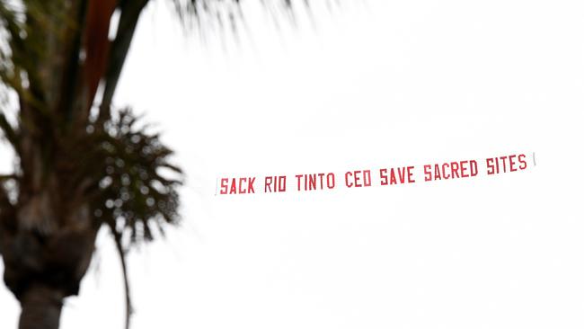 A sign towed by a plane visible over central Brisbane on Thursday. Picture: NCA NewsWire/Dan Peled