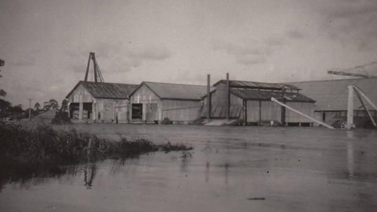 Industrial buildings in floodwaters, 1955. Large industrial structures submerged during the widespread flooding of 1955. Source: Unknown