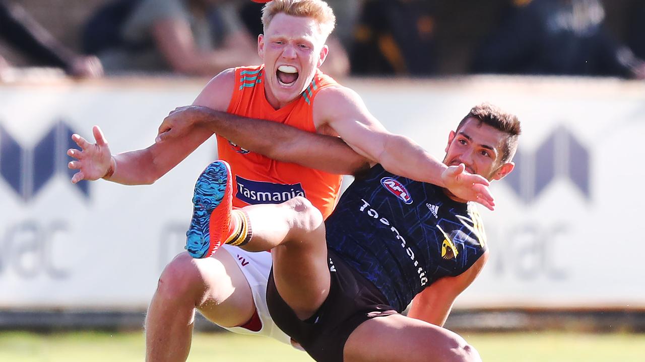 Darren Minchington battles James Sicily in a contest at Hawthorn training.