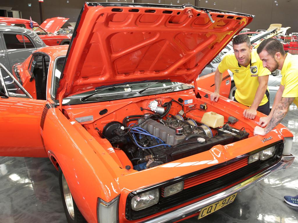 (L-R) Nick Montgomery and Roy O'Donovan check out a 1971 Valient Charger. Mariners Partnership With Car Museum. Picture: Mark Scott