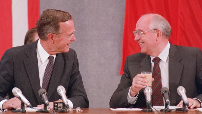 George Bush Sr and Mikhail Gorbachev: Putin believes Gorbachev betrayed the country Picture: AFP.