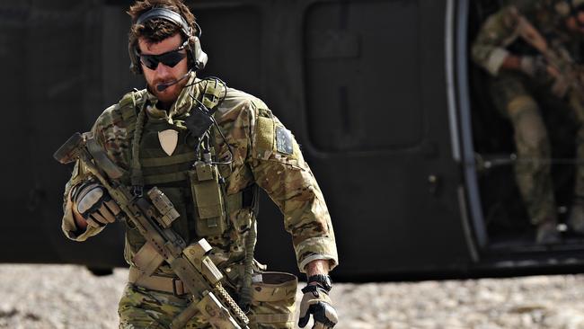 Australian Army soldier Corporal Benjamin Roberts-Smith, VC, MG, with the Special Operations Task Group, moves away from a United States UH-60 Black Hawk helicopter during preparations for the Shah Wali Kot Offensive in southern Afghanistan. *** Local Caption *** In June 2010, Afghan National Security Forces (ANSF) partnered with Australian special forces from the Special Operations Task Group to conduct a deliberate operation to clear a Taliban insurgent stronghold in the Shah Wali Kot region of northern Kandahar province.  The Shah Wali Kot Offensive comprised synchronised and deliberate clearance operations involving Australian commandos combined with a number of surgical helicopter-born assaults from Special Air Service (SAS) troops on key targets.  Removing Taliban insurgents from Afghan communities allows the Government of Afghanistan to establish a presence and gain the trust of the community to provide them with necessary infrastructure and security that was not provided by the insurgents.  The Shah Wali Kot Offensive was part of Australiaâs contribution to Operation Hamkari, an ISAF operation to extend the Government of Afghanistanâs influence into Kandahar City in southern Afghanistan. Picture: Department of Defence