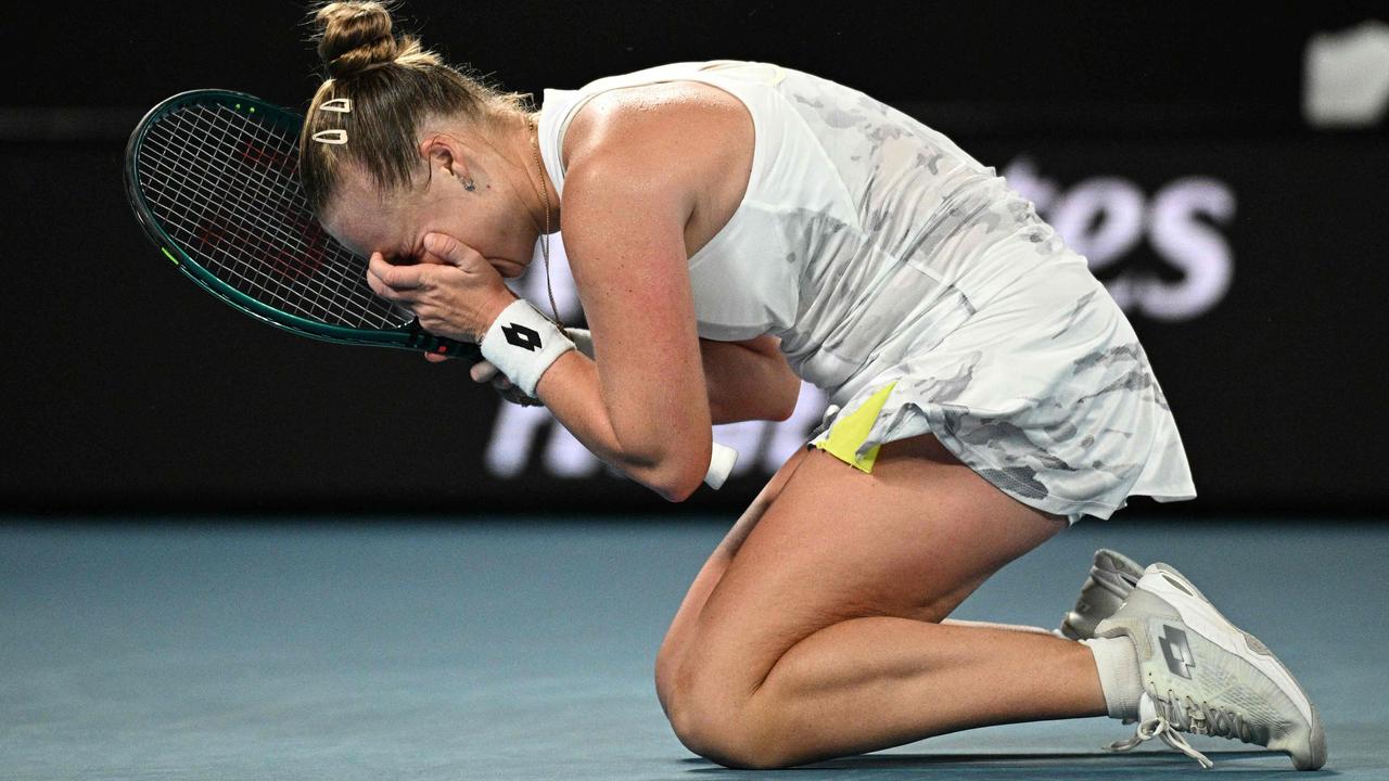 Blinkova fell to her knees after the win. Photo by Anthony WALLACE / AFP