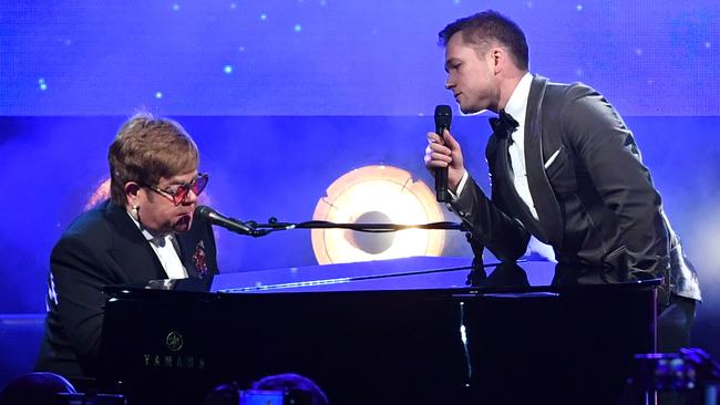 Sir Elton John and Taron Egerton perform during the <i>Rocketman</i> gala party at the Cannes Film Festival last week. Picture: Gareth Cattermole/Getty Images