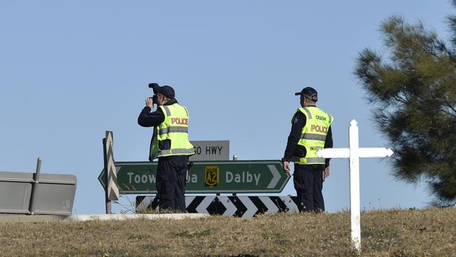 Police Forensic Crash Unit (FCU) officers at the scene of a fatal car and truck crash at intersection of  Warrego Hwy and Toowoomba Rd, Oakey, Sunday, May 3, 2020. Picture: Kevin Farmer