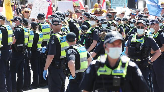 Police at a Covid Freedom rally as it makes its way past the Australian Open in January. Picture: NCA NewsWire / David Crosling