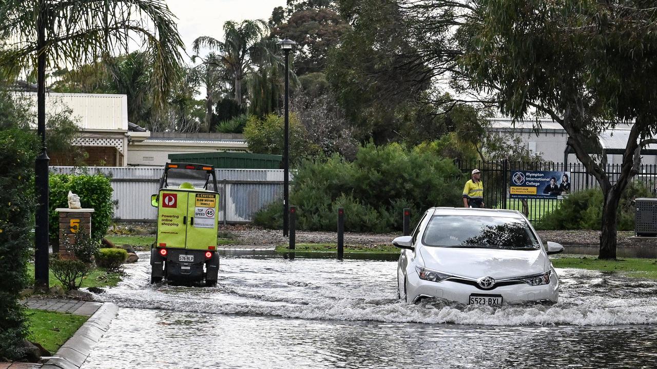 A car drives through flood water in Adelaide. Picture: NCA NewsWire / Brenton Edwards