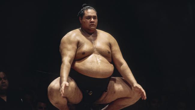 Akebono Taro (Chad Rowan), performs a ritual prior to a match in the San Jose Basho in California, 1993. Picture: Getty Images.