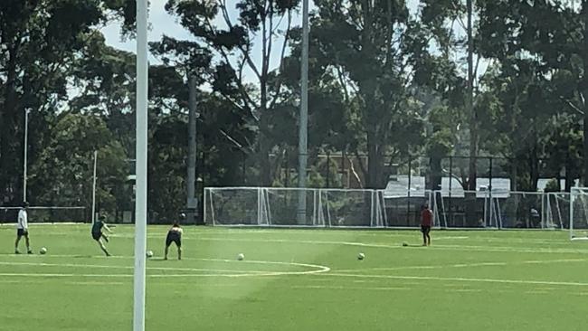 A group of four men were taking turns shooting at goal at Lionel Watts Reserve, Frenchs Forest, On Saturday. Picture: Jim O'Rourke