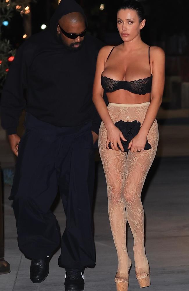 Who needs undies or a shirt when you have your favourite pair of lacy tights? Bianca Censori’s thoughts - yet again - as she dressed for dinner out with husband Kanye West. Picture: GAMR/KHROME / BACKGRID