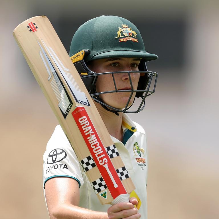 Annabel Sutherland raises her bat to the WACA crowd after walking off for the lunch break unbeaten on 113 – her second Test century. Picture: Paul Kane / Getty Images