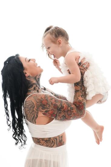 Cool mom Lisa-Marie shares a hug with her daughter.  VANCOUVER, CANADA: THIS MOM felt ashamed of her body during her pregnancy after spending over £ 60,000 on tattoos and said most men would not date her because they found she had it. look like 
