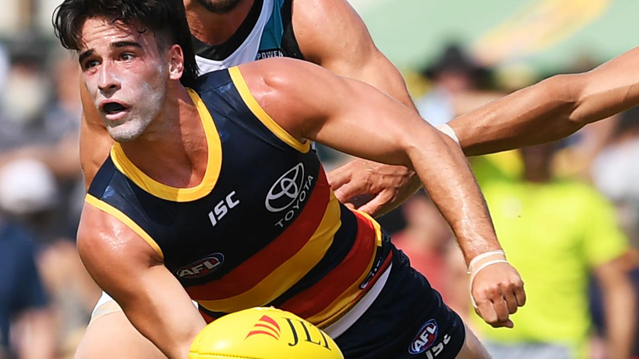 Adelaide Crows Lachlan Murphy handballs during the match against Port Adelaide at Memorial Oval, Port Pire. Pictutre: Mark Brake/Getty