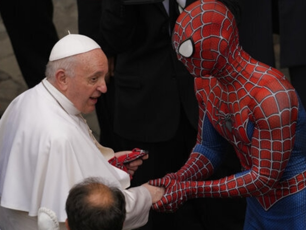 Pope Francis meets a man wearing a Spider-Man costume, who presented him with his mask, at the end of his weekly general audience with a limited number of faithful in the San Damaso Courtyard at the Vatican, on June 23, 2021. Picture: AP