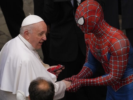 Pope Francis meets a man wearing a Spider-Man costume, who presented him with his mask, at the end of his weekly general audience with a limited number of faithful in the San Damaso Courtyard at the Vatican, on June 23, 2021. Picture: AP
