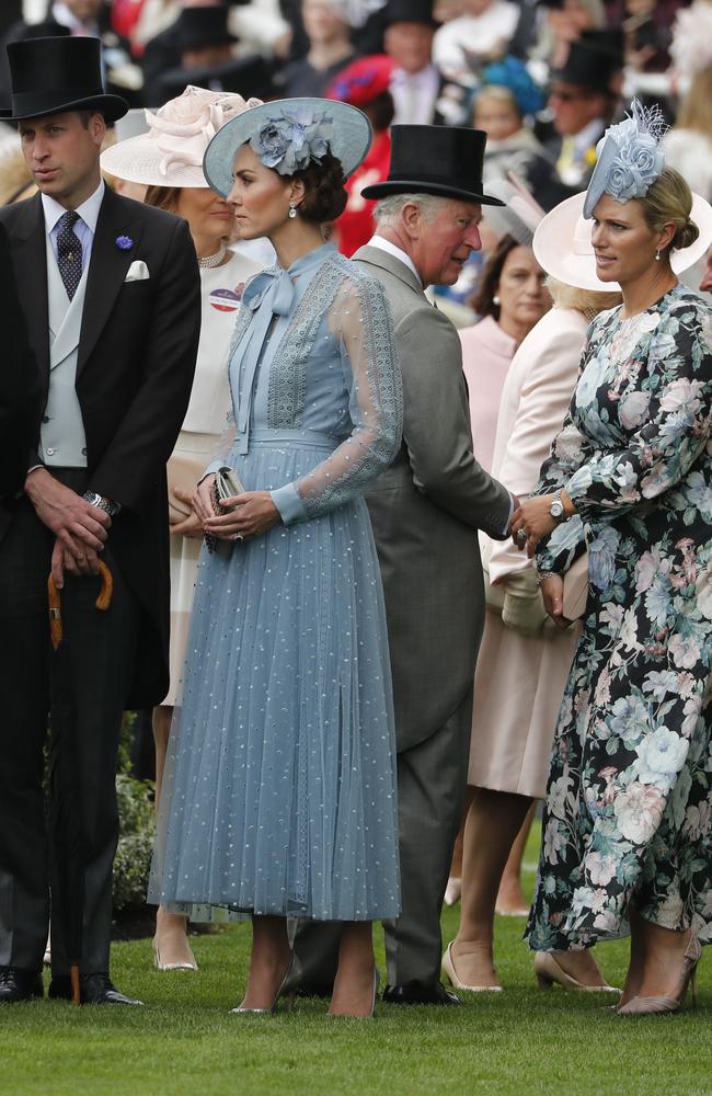 Prince William and Prince Charles wore top hats and tails, while Kate and Zara Tindall wore baby blue hats, elegant dresses and heels. Picture: AP Photo/Alastair Grant