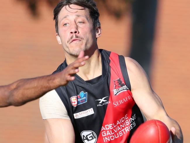 SANFL - Saturday, August 1st, 2020 - West Adelaide v Norwood at Westies home ground. West Adelaide Kaine Stevens under pressure from Anthony Wilson Picture: Sarah Reed