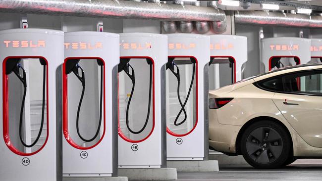 A Tesla electric car being charged at a car park in Germany’s capital, Berlin. Picture: AFP