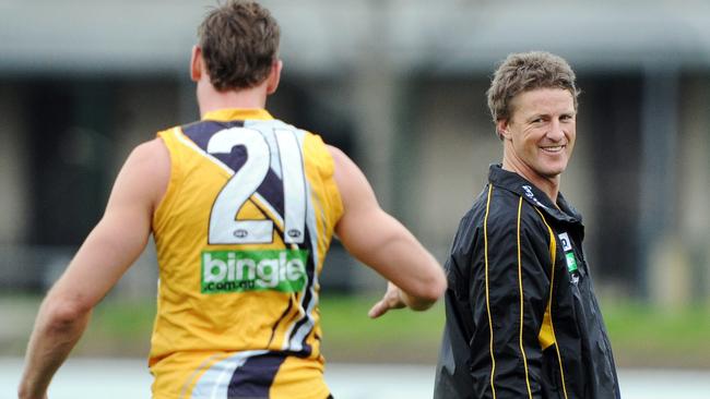 Coach Damien Hardwick has a laugh with Shane Tuck at Richmond training.