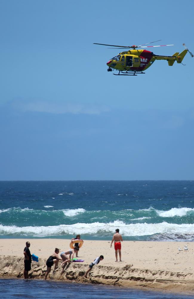 The Westpac Lifesaver helicopter searching for Junaid Mohammed at Moonee Beach earlier this week. Picture: Nathan Edwards