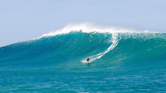 Allan Byrne surfing a wave in Hawaii on his 60th birthday Picture: Supplied