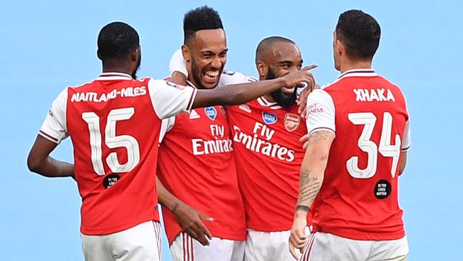 Gunners players celebrate as they take the lead. Picture: AFP