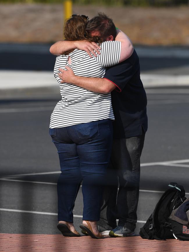 Evacuees embraced with loved ones at the Hastings port. Picture: AAP