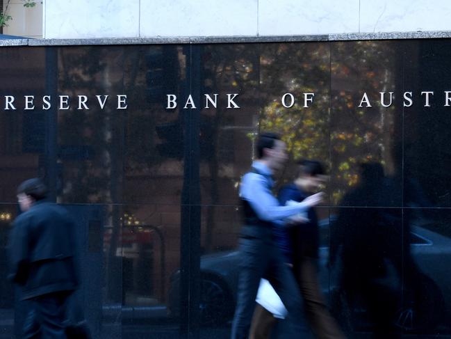 People walk past the Reserve Bank of Australia (RBA) building in Sydney, Wednesday, June 3, 2020. Australia's economy contracted 0.3 per cent in the March quarter, broadly in line with market expectations. (AAP Image/Bianca De Marchi) NO ARCHIVING