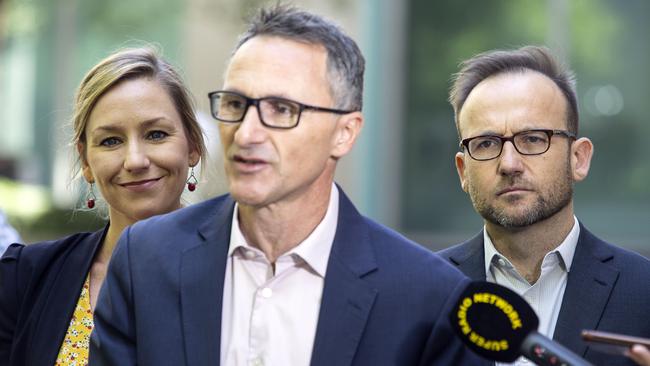 Potential Greens leaders Larissa Waters and Adam Bandt flank Richard Di Natale in Canberra as he announces his decision to leave federal parliament. Picture Gary Ramage