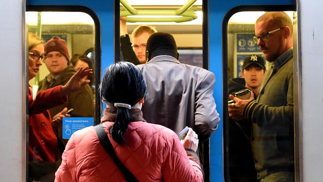 Commuters dash for a morning peak-hour train at Footscray railway station. Picture: Nicole Garmston