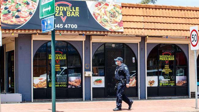 Police outside the Woodville Pizza Bar. Picture: Matt Turner