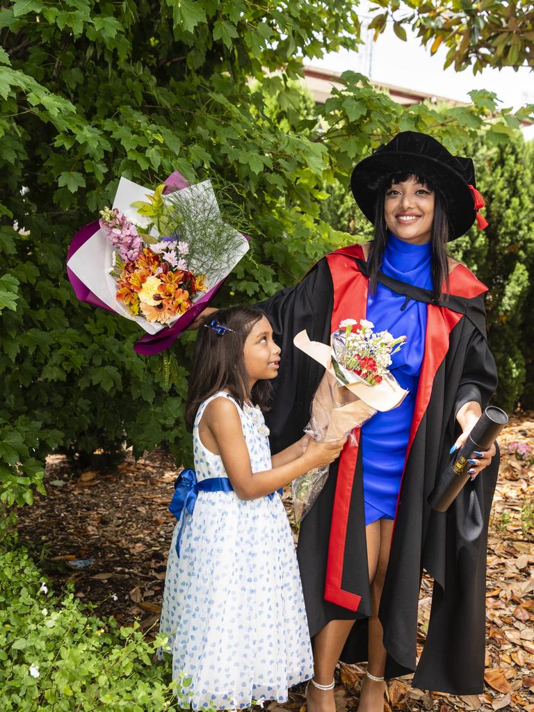 PhD graduate (chronic obstructive pulmonary disease) Hancy Issac with daughter Thea Arun at the UniSQ graduation ceremony at Empire Theatres, Tuesday, December 13, 2022.