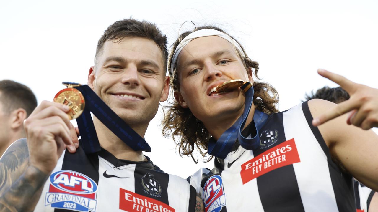 Jamie Elliott and Ginnivan with their premiership medals. Picture: Getty Images