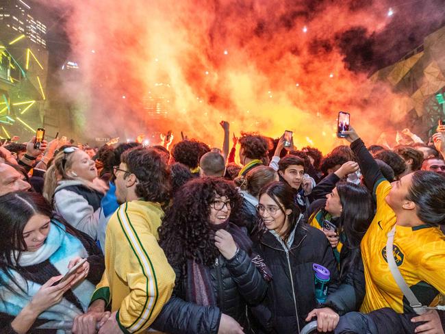 A flare gets set off at Federation Square. Picture: Jake Nowakowski