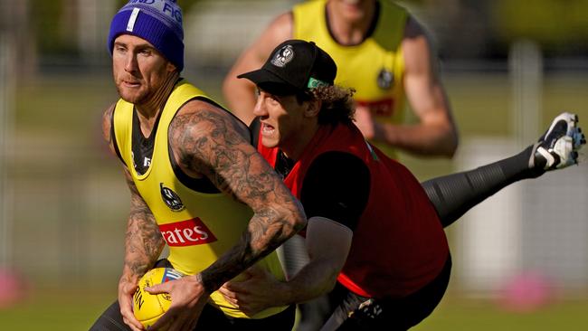 Jeremy Howe is tackled by teammate Chris Mayne at Collingwood training. Picture: Scott Barbour/AAP