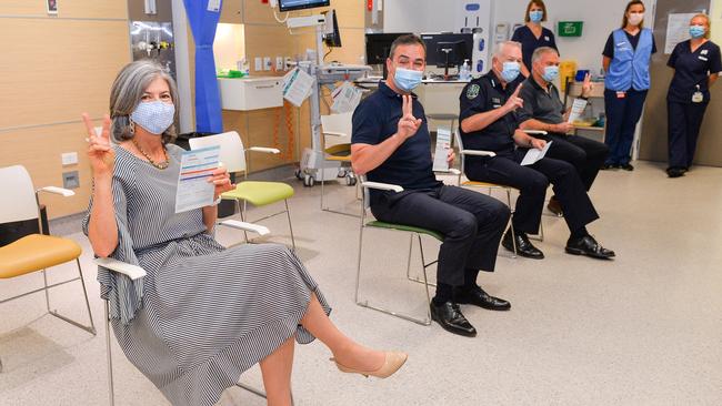 SA’s chief public health officer Nicola Spurrier, Premier Steven Marshall, health minister Stephen Wade and Police Commissioner Grant Stevens pose for pictures after getting their second vaccinations in March. Picture: Brenton Edwards