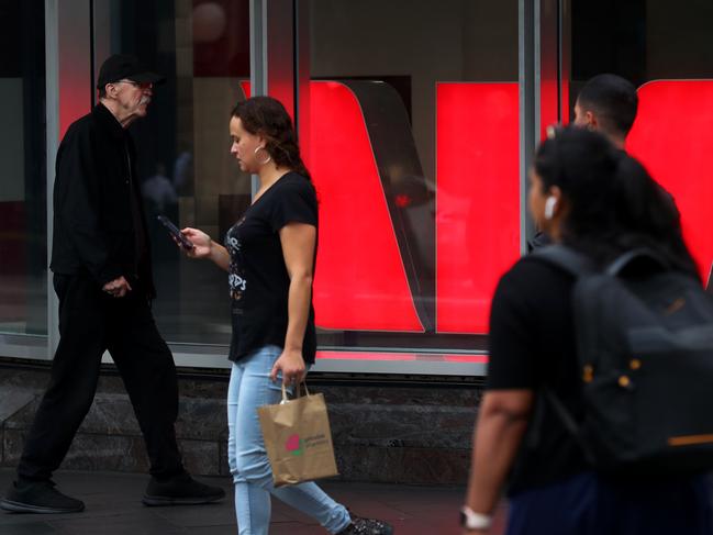 SYDNEY, AUSTRALIA - MARCH 26: Pedestrians move past a Westpac Bank in the central business district (CBD) on March 26, 2025 in Sydney, Australia. The budget is expected to return to deficit after two years of surplus, focusing on cost-of-living relief measures, including extended electricity rebates and increased healthcare spending, while also addressing economic challenges and potential voter concerns ahead of the upcoming federal election. (Photo by Lisa Maree Williams/Getty Images)