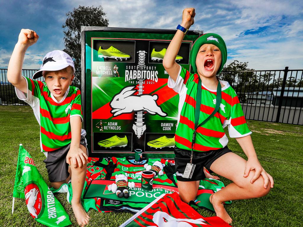 Souths Super Fans - Jeff Hamnett is an NRL super fan with framed footy boots from Cooke, Latrell, Walker and Reynolds. His two kids L-R: AJ Hamnett and Jai Hamnett. Picture: Nigel Hallett