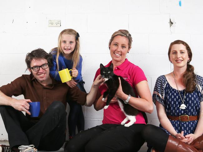 Owners Adam and Dimity Honeyman with daughter Israel 6 and Abby Laskey (pink top) Manager of the RSPCA Hobart Centre with Dimity the kitten. The Hobart Cat Cafe is set to open in the coming months in North Hobart. Picture Nikki Davis-Jones