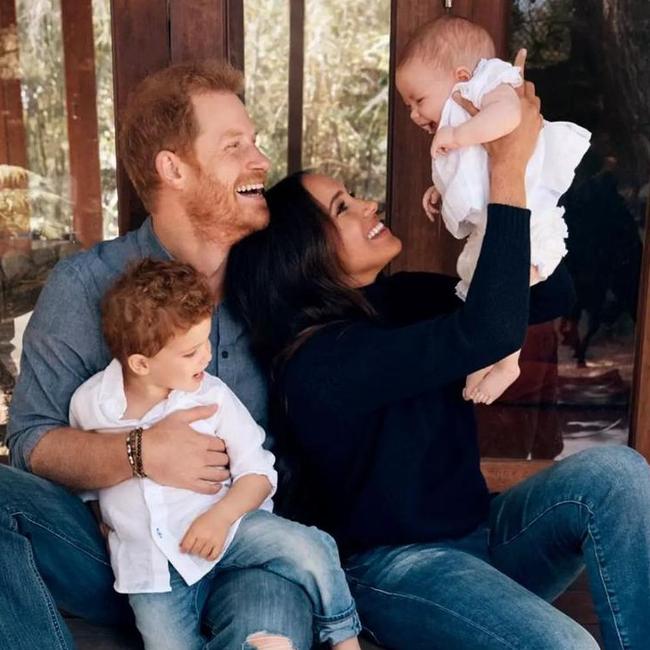 Harry and Meghan pose for their Christmas card in 2021 with Archie and Lilibet.