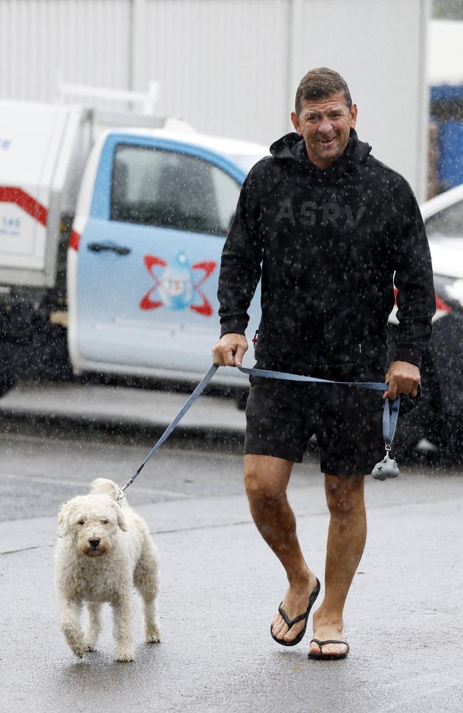 Jason Demetriou taking his dog for a walk in Caringbah South on Wednesday. Picture: Jonathan Ng