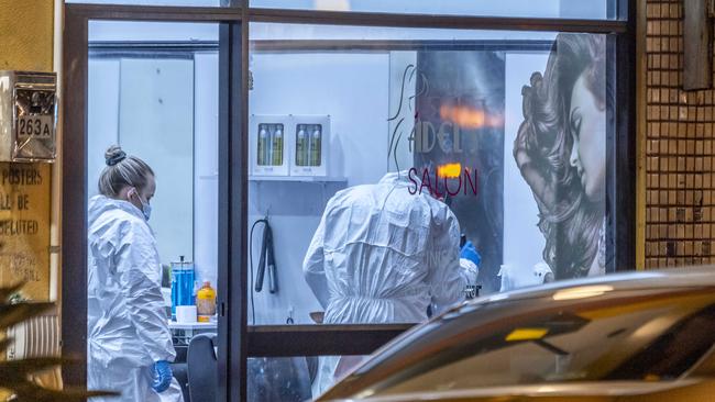 Forensics teams remained at the salon into Friday night. Picture: Monique Harmer