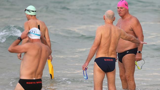 Swimmers, many local residents patiently waited as the gate was opened, to allow swimming and surfing at Sydney's iconic Bondi Beach for the first time in four weeks.