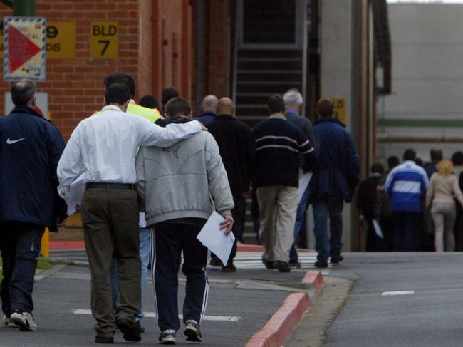 Kodak workers leave the Coburg factory in 2004 after being told Kodak will cease making photographic products.