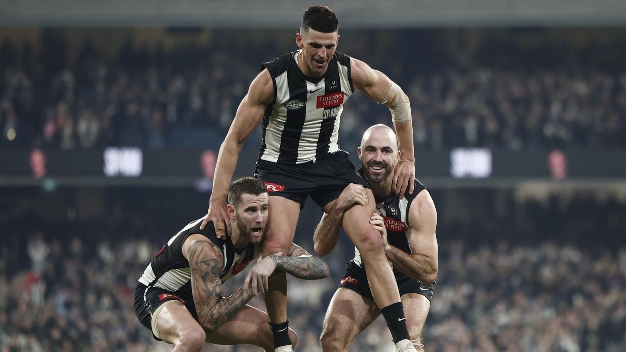 MELBOURNE, AUSTRALIA - AUGUST 03: Scott Pendlebury of the Magpies is chaired off the ground by Jeremy Howe (L) and Steele Sidebottom of the Magpies after playing his 400th game and winning the round 21 AFL match between Collingwood Magpies and Carlton Blues at Melbourne Cricket Ground, on August 03, 2024, in Melbourne, Australia. (Photo by Daniel Pockett/Getty Images)