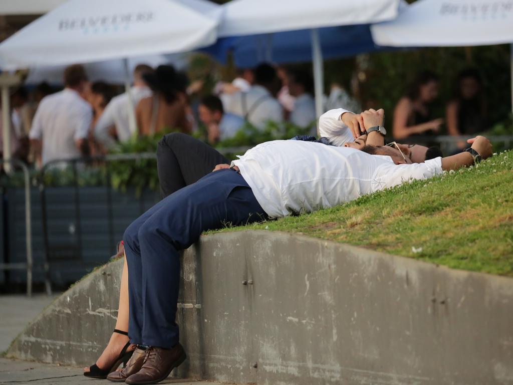 This group of Sydneysiders take a well earned rest after a day of celebrating at Barangaroo. Picture: Christian Gilles