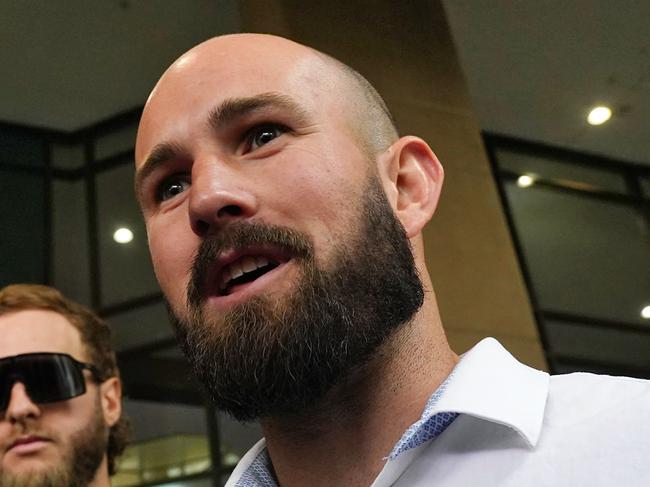 MELBOURNE AUSTRALIA - NewsWire Photos NOVEMBER 8, 2024: Prominent neo-Nazi Thomas Sewell alongside Joel Davis talk to members of the media outside the Melbourne Magistrates Court.Picture: NewsWire / Luis Enrique Ascui