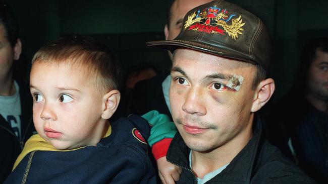 Boxer Kostya Tszyu with his son, Tim, arrive at Sydney Airport from the United States in 1997.